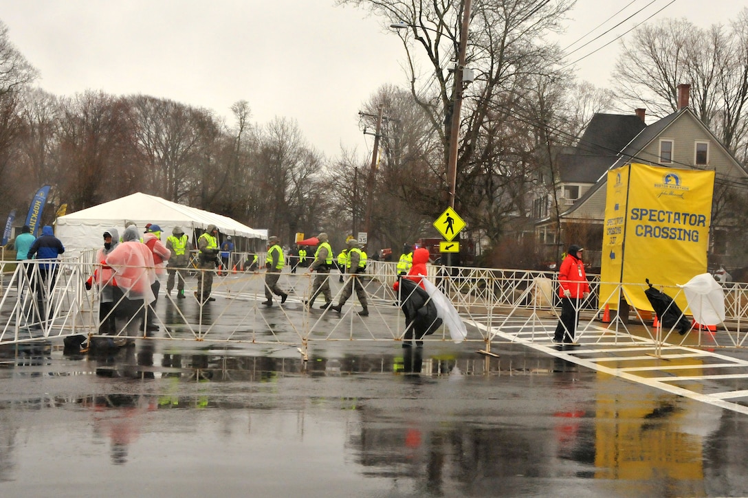 Airmen and soldiers provide security during the 122nd Boston Marathon.