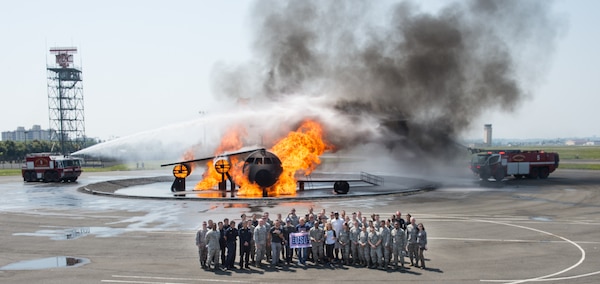 Entertainers pose for a photo with members of the the 374th Civil Engineer Squadron at Yokota Air Base, Japan; the first stop on the annual Vice Chairman's USO Tour, April 22, 2018. Comedian Jon Stewart, country music artist Craig Morgan, celebrity chef Robert Irvine, professional fighters Max "Blessed" Holloway and Paige VanZant, and NBA Legend Richard "Rip" Hamilton will join Gen. Selva on a tour across the world as they visit service members overseas to thank them for their service and sacrifice.