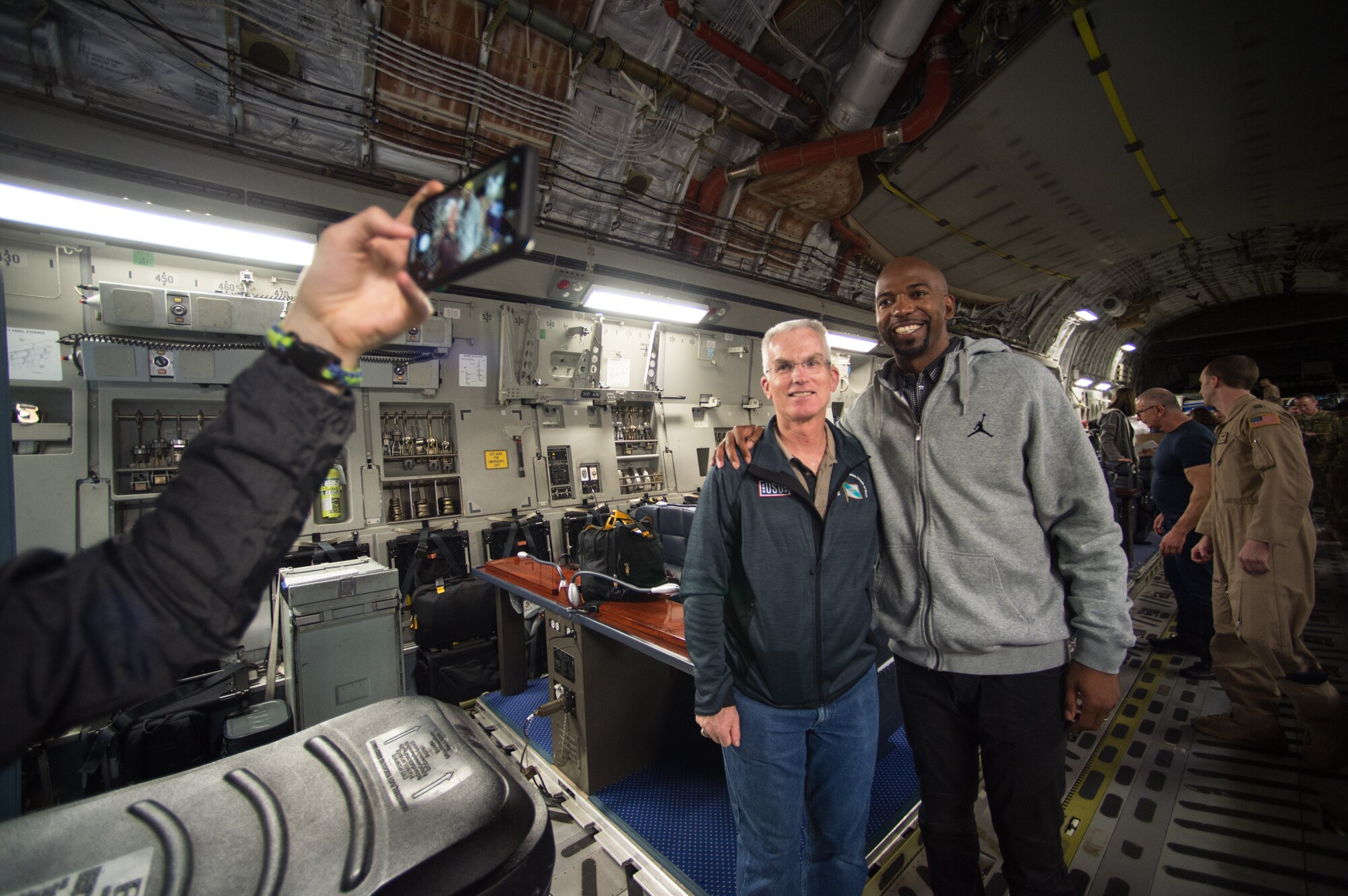 U.S. Air Force Gen. Paul J. Selva, Vice Chairman of the Joint Chiefs of Staff, poses for a photo with NBA Legend Richard "Rip" Hamilton board a C-17 aircraft before departing on the annual Vice Chairman's USO Tour, April 20, 2018 at Joint Base Andrews, Md. Comedian Jon Stewart, country music artist Craig Morgan, celebrity chef Robert Irvine, professional fighters Max Holloway and Paige VanZant, and NBA Legend Richard "Rip" Hamilton will join Gen. Selva on a tour across the world as they visit service members overseas to thank them for their service and sacrifice.