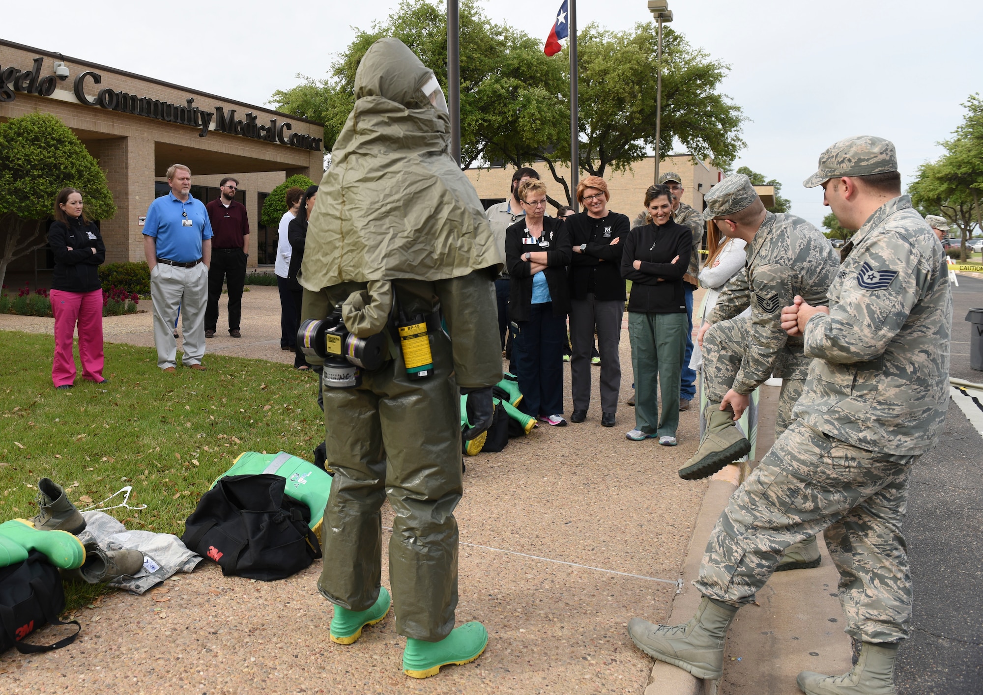 17th Medical Group members demonstrate the Toxicological Protective Coveralls, nicknamed the gumby suit, during a training sessions between Goodfellow and the San Angelo Community Medical Center, San Angelo Texas, April 19, 2018. This was the first training session between Goodfellow and SACMC to demonstrate decontaminations procedures.  (U.S. Air Force photo by Aryn Lockhart/Released)