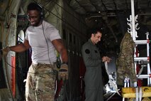 U.S. and Moroccan loadmasters work on a C-130J
