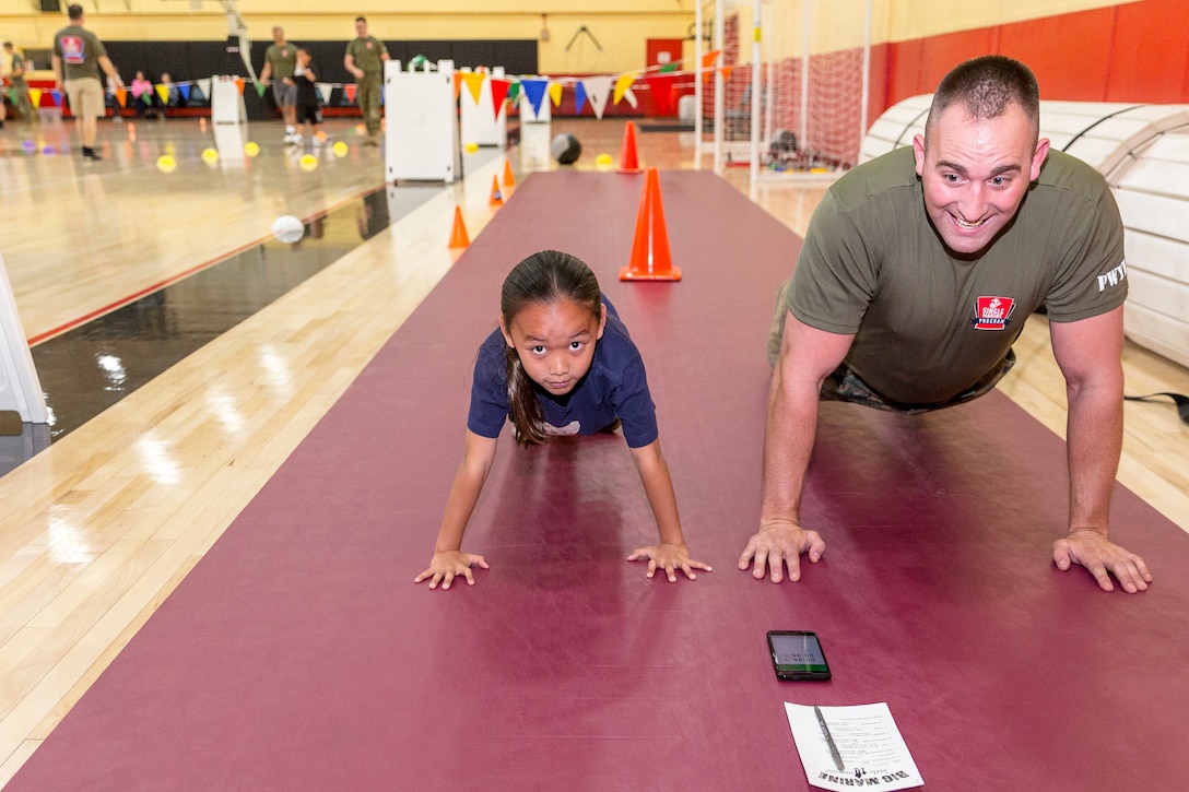 Push-ups was just one of many physical exercises during the Big Marine Little Marine High Intensity Tactical Training (HITT) competition aboard Marine Corps Logistics Base Barstow, Calif., April 18.