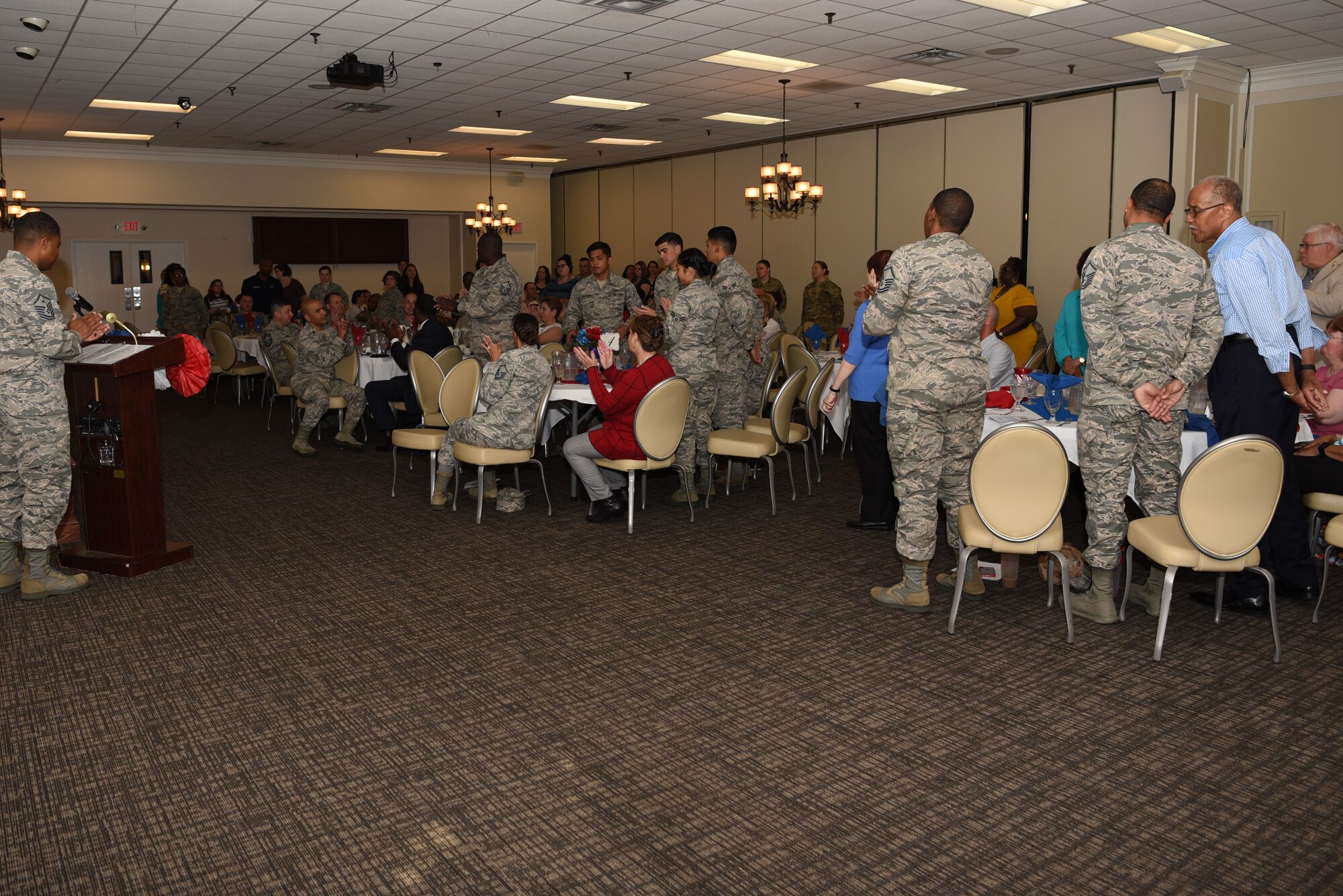 Volunteers stand to be recognized during an annual volunteer recognition ceremony at Shaw Air Force Base, S.C., April 19, 2018.