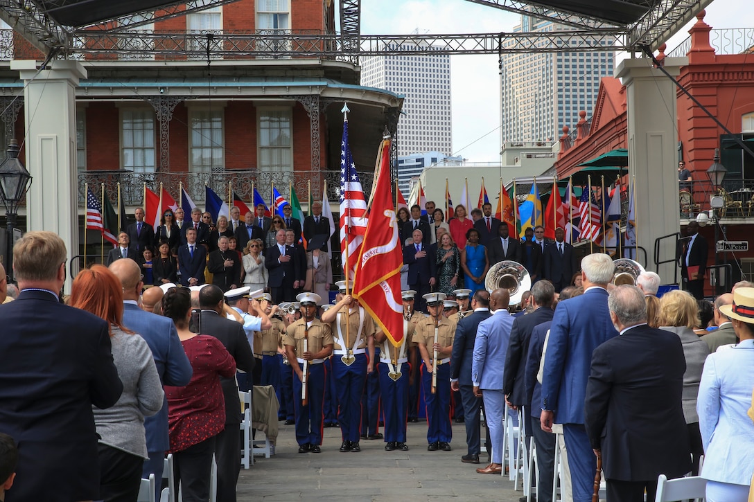 Marine Corps Band New Orleans, plays the national Anthem, accompanied by Marine Corps color guard, presenting colors, at the beginning of the New Orleans Tricentennial celebration in New Orleans, April 21, 2018. Marines and distinguished visitors from around the world gathered in the French Quarter to help celebrate the culture and history of New Orleans during the New Orleans Tricentennial ceremony. (U.S. marine Corps photo by Lance Cpl. Samantha Schwoch/released)