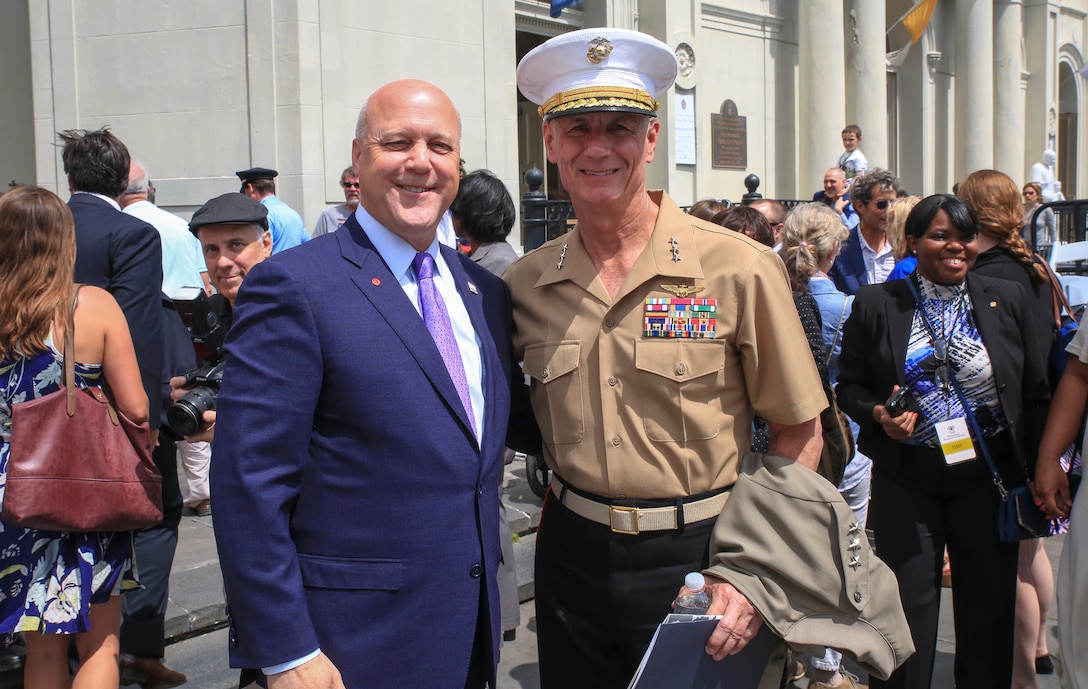 Lt. Gen. Rex C. McMillian (right), commanding general of Marine Forces Reserve and Marine Forces North, and Mitch Landrieu (left), mayor of New Orleans, pose for a photo following the New Orleans tricentennial ceremony in the French Quarter, New Orleans, April, 21, 2018. Service members and distinguished visitors from around the world gathered in the French Quarter to help celebrate the culture and history of New Orleans during the New Orleans Tricentennial ceremony. (U.S. Marine Corps photo by Lance. Cpl. Samantha Schwoch/released)