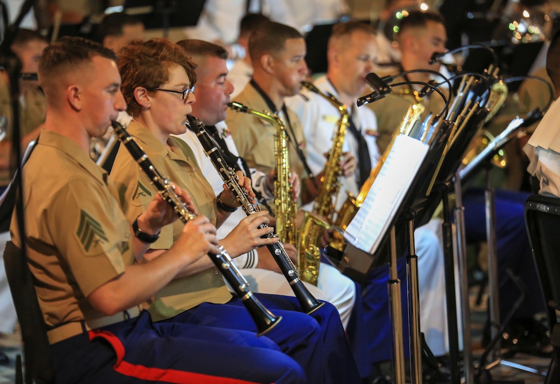 Marines with Marine Corps Band New Orleans accompanied by sailors from Navy Band Southeast out of Jacksonville, Florida, perform in the French Quarter in celebration of Navy Fleet week in New Orleans, April 21, 2018. The celebration is an opportunity for citizens of New Orleans and surrounding areas to meet service members and witness the latest capabilities of today’s maritime service. (U.S. Marine Corps photo by Lance Cpl. Samantha Schwoch/released)