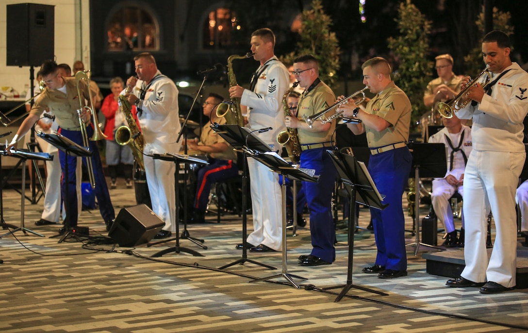 Brass instamentalists from Marine Corps Band New Orleans and Navy Band Southeast out of Jacksonville Florida, perform in the French Quarter in celebration of Navy Fleet week in New Orleans, April 21, 2018. The celebration is an opportunity for citizens of New Orleans and surrounding areas to meet service members and witness the latest capabilities of today’s maritime service. (U.S. Marine Corps photo by Lance Cpl. Samantha Schwoch/released)