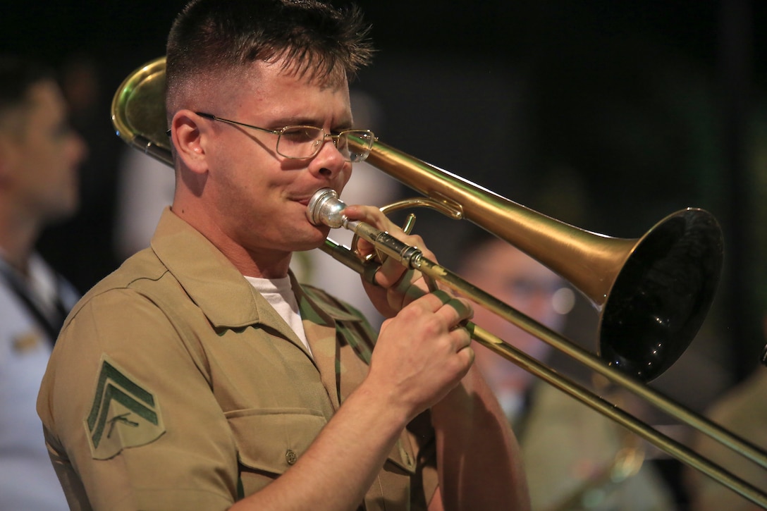 Cpl. David Linnenkamp, trombone instrumentalist with Marine Coprs Band New Orleans, performs a solo in the French Quarter in celebration of Navy Fleet week in New Orleans, April 21, 2018. The celebration is an opportunity for citizens of New Orleans and surrounding areas to meet service members and witness the latest capabilities of today’s maritime service. (U.S. Marine Corps photo by Lance Cpl. Samantha Schwoch/released)