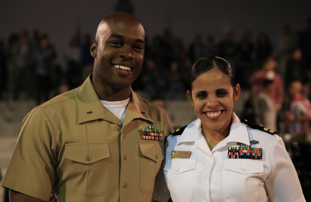 Chief Warrant Officer 2 DeMarius Jackson (left), officer in charge of Marine Corps Band New Orleans, poses with Luslaida Barbosa (right), director of Navy Band Southest out of Jacksonville, Florida, following the performance of the their bands in the French Quarter in celebration of Navy Fleet week in New Orleans, April 21, 2018. The celebration is an opportunity for citizens of New Orleans and surrounding areas to meet service members and witness the latest capabilities of today’s maritime service. (U.S. Marine Corps photo by Lance Cpl. Samantha Schwoch/released)