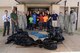 Members of the 72nd Air Base Wing pose with several bags of trash they picked up from the area around the ABW Headquarters. 72ABW Commander Col. Kenyon Bell, far right, encourages everyone to do their part in keeping the installation clean and well-kept and take pride in Tinker every day.
