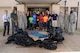 Members of the 72nd Air Base Wing pose with several bags of trash they picked up from the area around the ABW Headquarters. 72ABW Commander Col. Kenyon Bell, far right, encourages everyone to do their part in keeping the installation clean and well-kept and take pride in Tinker every day.