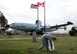 Tech. Sgt. Christopher Craig, with the 552nd Air Control Network Squadron, picks up trash around the EC-121 'Connie' static display.