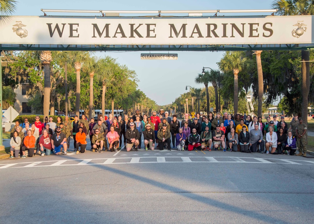 Attendees of the Educators Workshop pose for a group photo under the “We Make Marines” sign aboard Marine Corps Recruit Depot Parris Island, South Carolina, April 19, 2017. These educators traveled from Recruiting Station (RS) Baton Rouge and RS Columbia to experience the Educators Workshop. The workshop allows educators to have an inside look at educational benefits and career opportunities in the Marine Corps to better inform their students. (U.S. Marine Corps photo by Lance Cpl. Jack A. E. Rigsby)