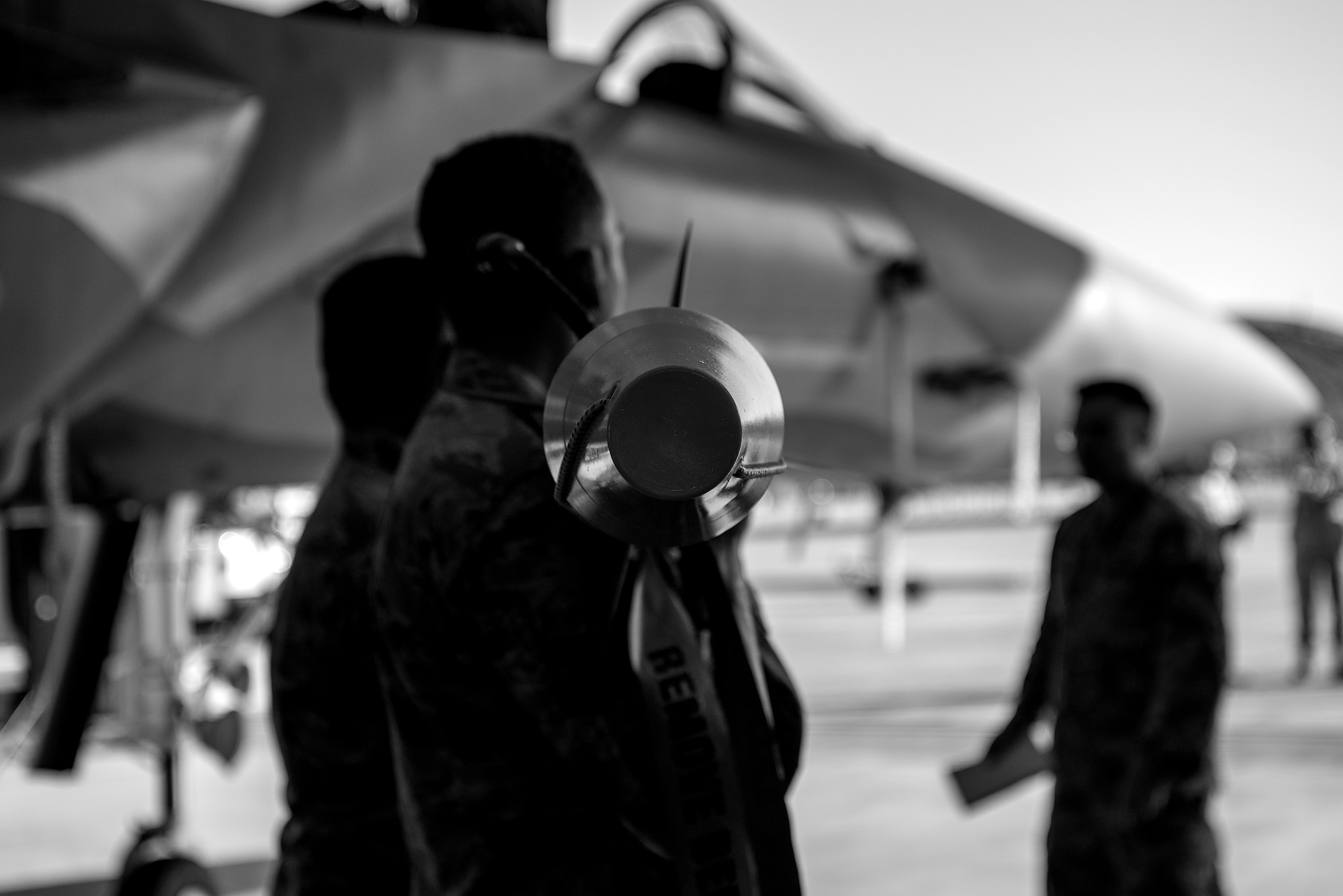 Airmen from the 4th Aircraft Maintenance Squadron lift an AIM-9X munition during a load crew competition, April 20, 2018, at Seymour Johnson Air Force Base, North Carolina.