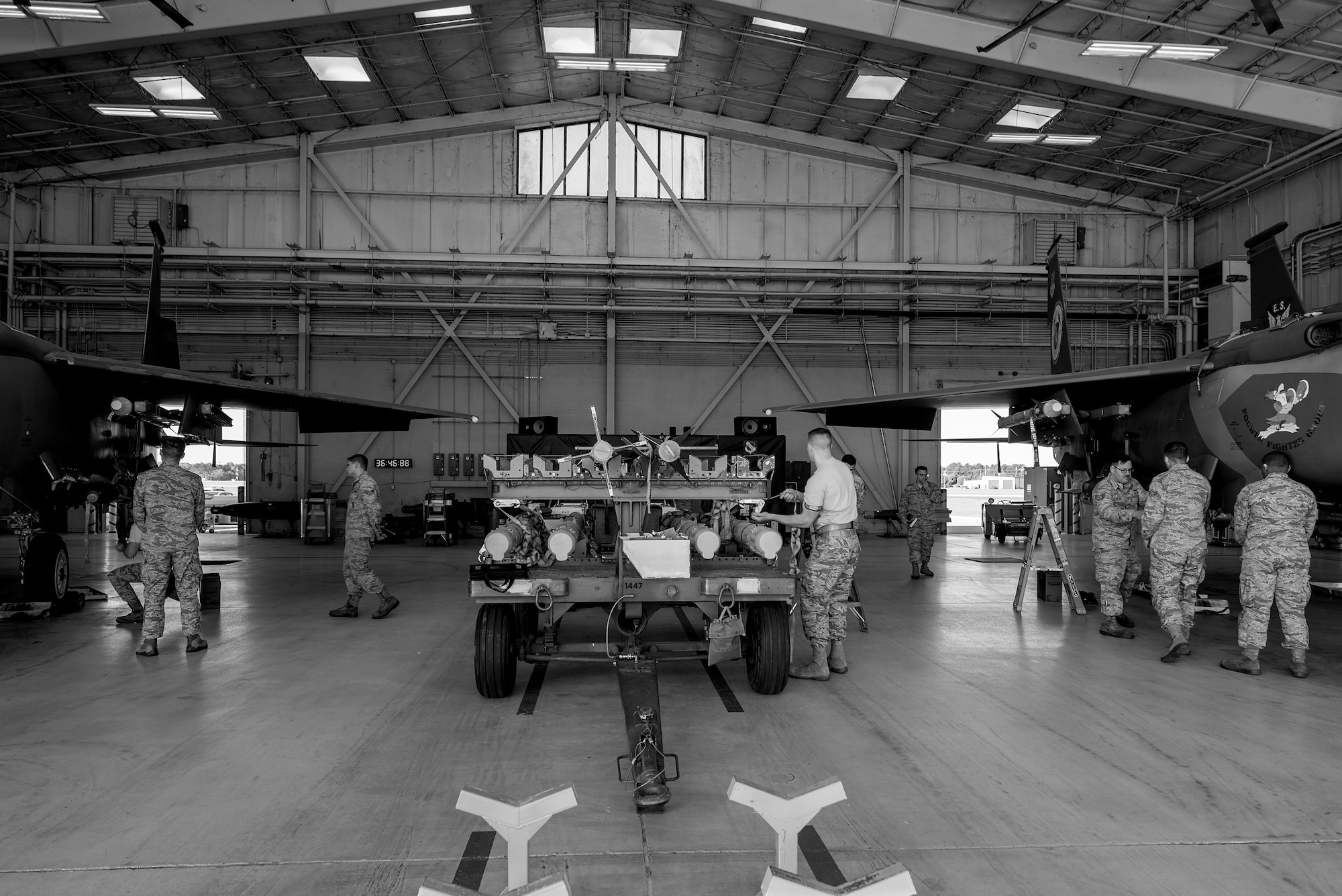 Airmen from the 4th Aircraft Maintenance Squadron compete in teams of three against each other during a load crew competition, April 20, 2018, at Seymour Johnson Air Force Base, North Carolina.
