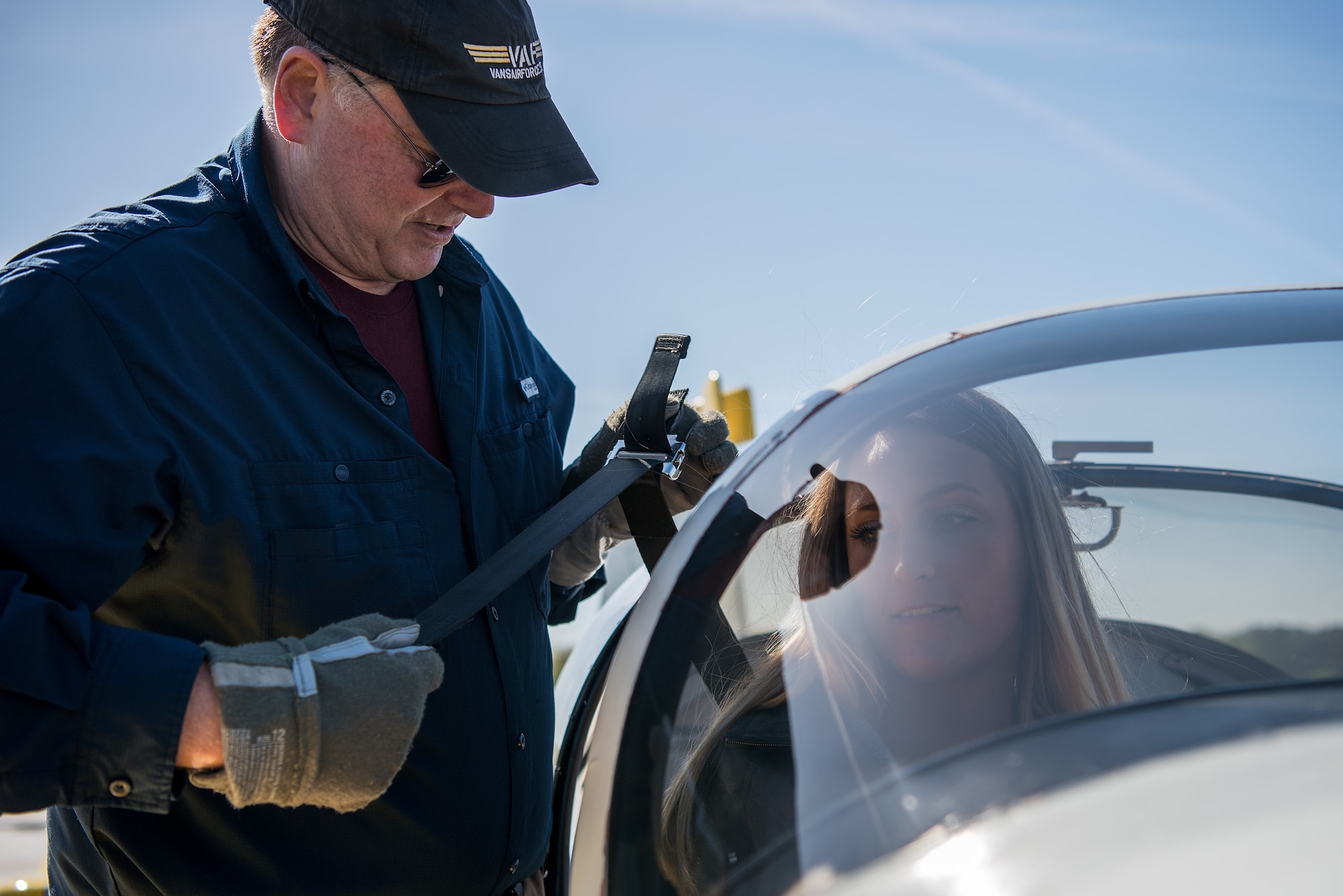 William “Boo-boo” Miller (left), Controller Appreciation coordinator, helps Senior Airman Payton Rossi, 4th Operations Support Squadron air traffic controller, into his RV9A aircraft, April 21, 2018, in Pikeville, North Carolina.