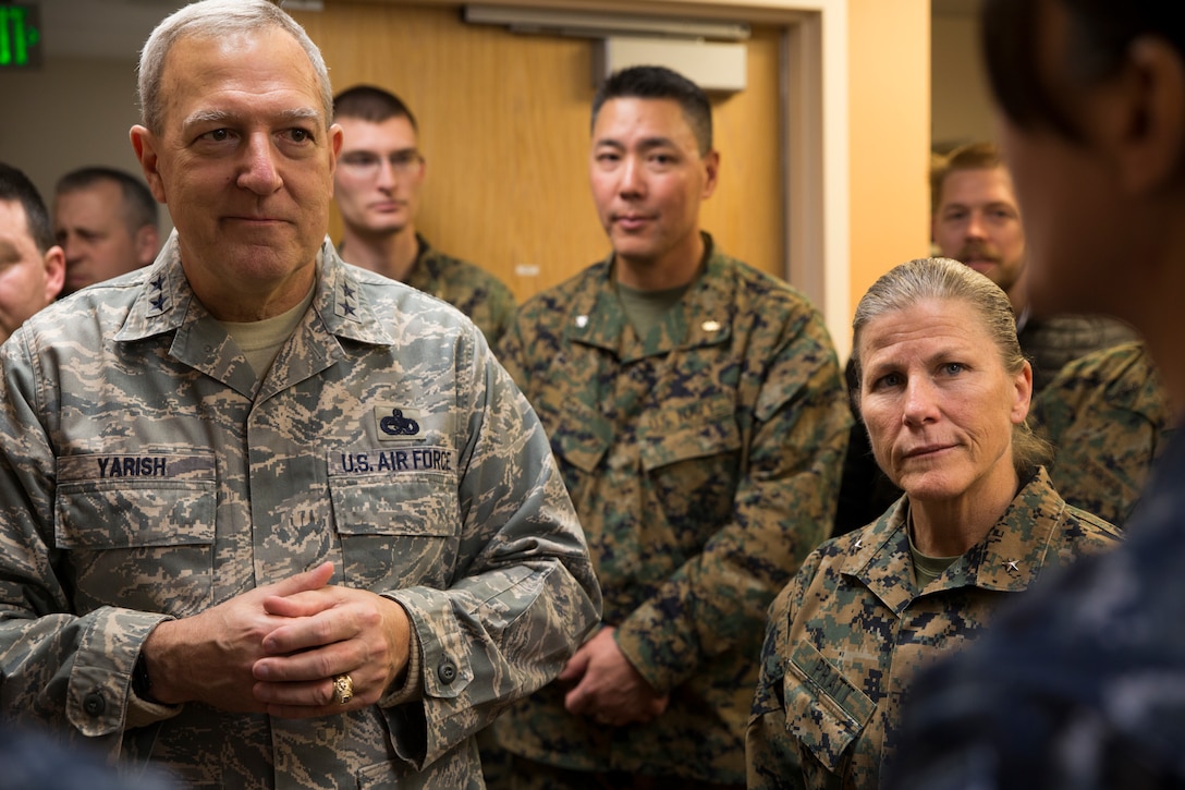 Maj. Gen. Edward P. Yarish, left,  special assistant to the commander, Air Force Reserve Command, and Brig. Gen. Helen G. Pratt, commanding general of 4th Marine Logistics Group, talk with service members supporting Innovative Readiness Training Arctic Care 2018, Kotzebue, Alaska, April 21, 2018.