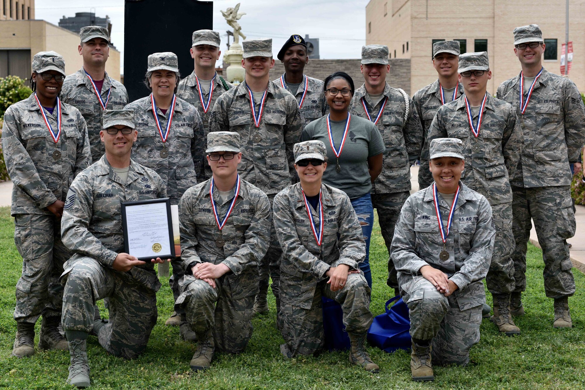 Members from Goodfellow Air Force Base receive Star Reader medallions outside the San Angelo courthouse in San Angelo, Texas, April 20, 2018.  The Tom Green County Library marked the 2018 Read to Me gathering as a time for the students to thank military and veterans for their service. (U.S. Air Force photo by Senior Airman Randall Moose/Released)