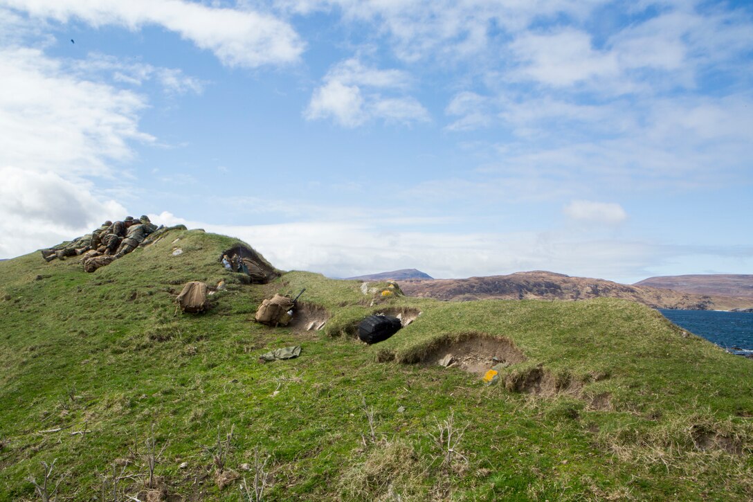 Reserve Marines with 4th Air Naval Gunfire Liaison Company, Force Headquarters Duty, position themselves at an observation post to scout possible call-for-fires targets, in Cape Wrath, Scotland, April 23, 2018.
