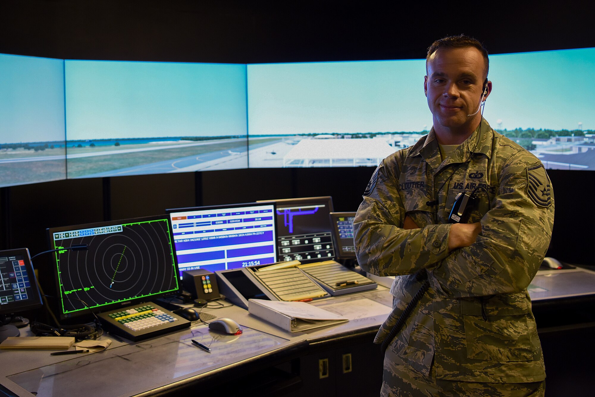 U.S. Air Force Master Sgt. Brian Cloutier, 81st Training Wing protocol NCO in charge, poses for a photo in the air traffic control tower simulator at Keesler Air Force Base, Mississippi, March 28, 2018. Cloutier, a former air traffic controller of 13 years, has been recently selected to become a remotely piloted aircraft pilot. (U.S. Air Force photo by Airman 1st Class Suzie Plotnikov)