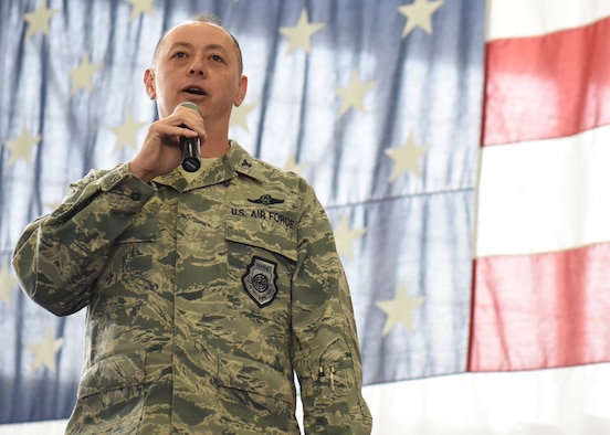 Col. John Edwards, 28th Bomb Wing Commander, addresses Airmen inside the Pride Hangar during Wingman Day at Ellsworth Air Force Base, S.D., April 20, 2018. Wingman Day is a semiannual event that focuses on developing the four pillars of Comprehensive Airmen Fitness, and recently focused on strengthening the physical and social pillars through physical and team-building activities.  (U.S. Air Force photo by Airman 1st Class Thomas Karol)