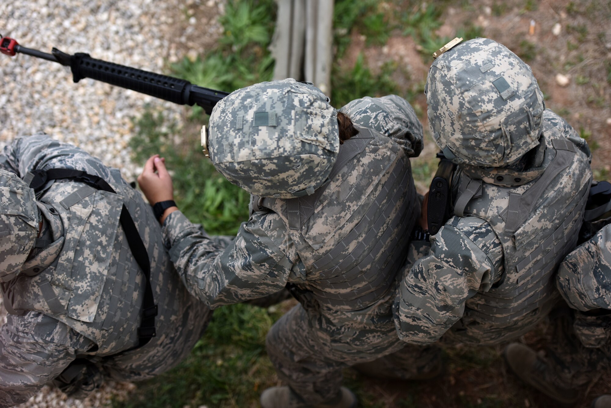 Air Force ROTC Cadets from San Angelo State University prepare to charge and clear a structure during the training exercise held at the mock forward operating base on Goodfellow Air Force Base, Texas, April 20, 2018. The cadets had to work as a team and learn effective communication before being allowed to move onto other points of training. (U.S. Air Force photo by Airman 1st Class Seraiah Hines/Released)