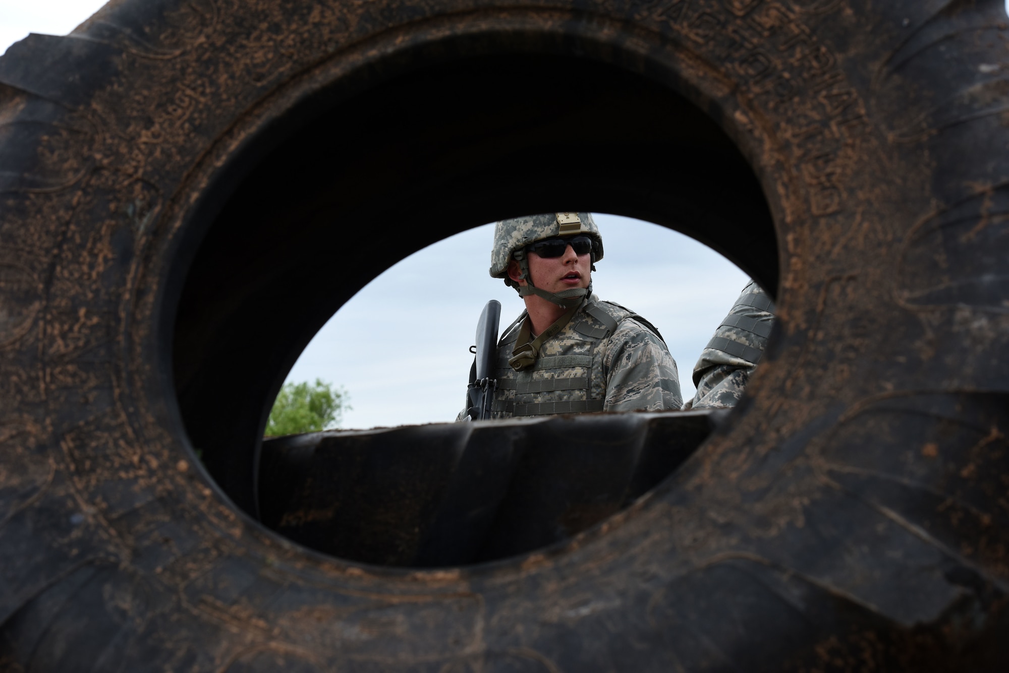 Justin O’Brien, Angelo State University Air Force ROTC cadet, takes cover during one of the exercises at the mock forward operating base on Goodfellow Air Force Base, Texas, April 20, 2018. The training exercise was meant to push cadets to expand their communication and leadership skills they have been taught in the classroom. (U.S. Air Force photo by Airman 1st Class Seraiah Hines/Released)