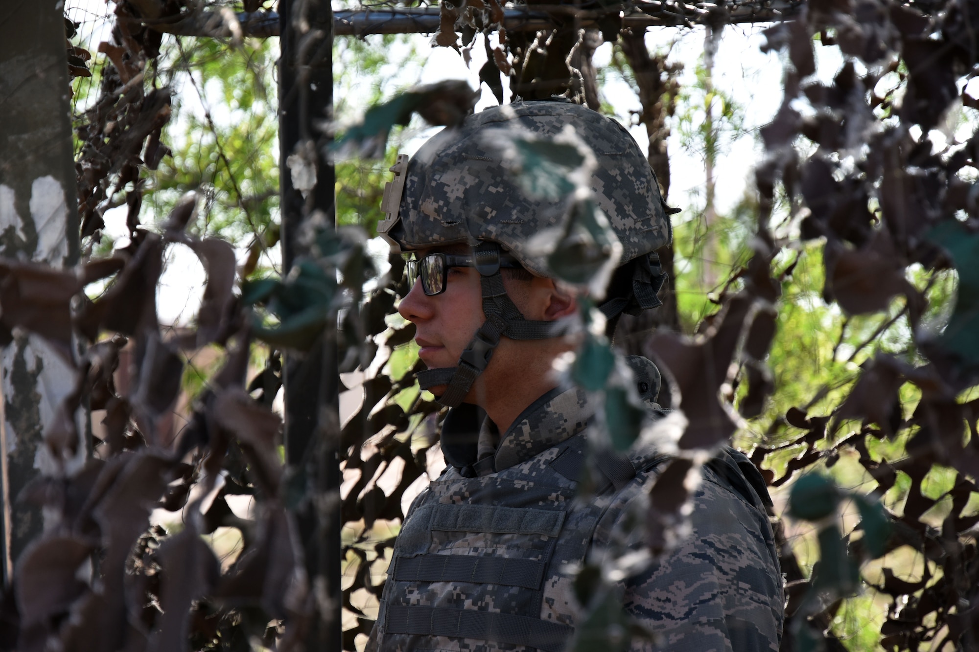 Michael Reyes, Angelo State University Air Force ROTC cadet, prepares for his shift as entry controller at the mock forward operating base on Goodfellow Air Force Base, Texas, April 21, 2018. The cadets were on rotating shifts of entry controller, guard tower and patrol. (U.S. Air Force photo by Airman 1st Class Seraiah Hines/Released)