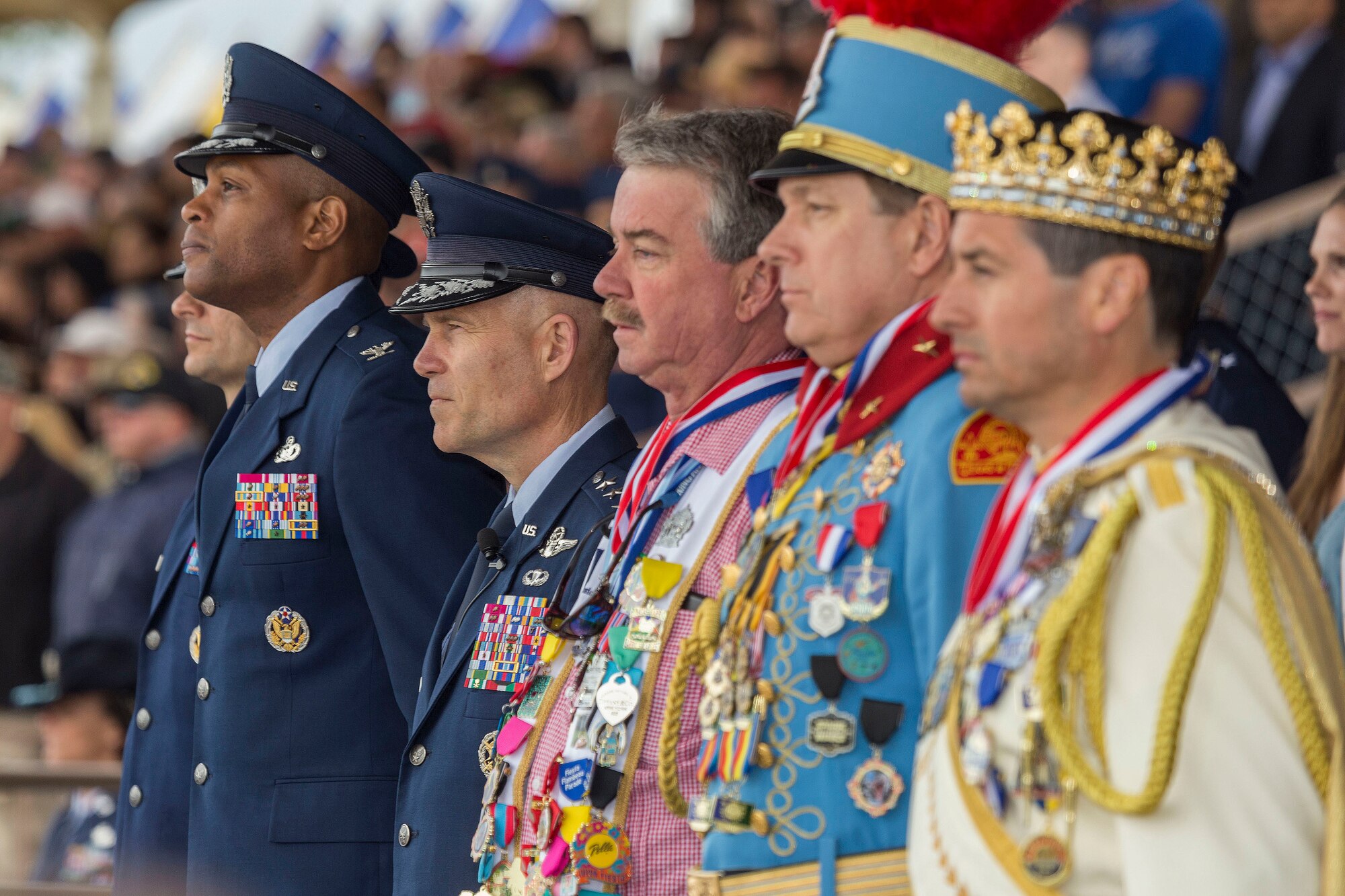 Military and civilian personnel stand at Joint Base San Antonio-Lackland, Texas during a Basic military training graduation ceremony April 20, 2018. The ceremony also acknowledged the beginning of “Fiesta San Antonio,” the city’s annual festival held to honor the memory of the battles of the Alamo and San Jacinto. (U.S. Air Force photo by Ismael Ortega / Released)