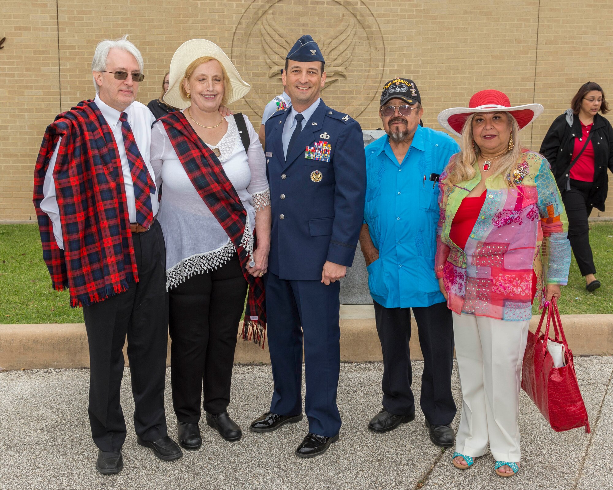 David Lackland (Left) and his wife Eileen take a group photo at Joint Base San Antonio-Lackland, Texas after a basic military training graduation ceremony April 20, 2018. David is the cousin of Brig. Gen. Frank D. Lackland, the namesake of JBSA-Lackland. Today is the first time David and Eileen have viewed a BMT graduation. (U.S. Air Force photo by Ismael Ortega / Released)