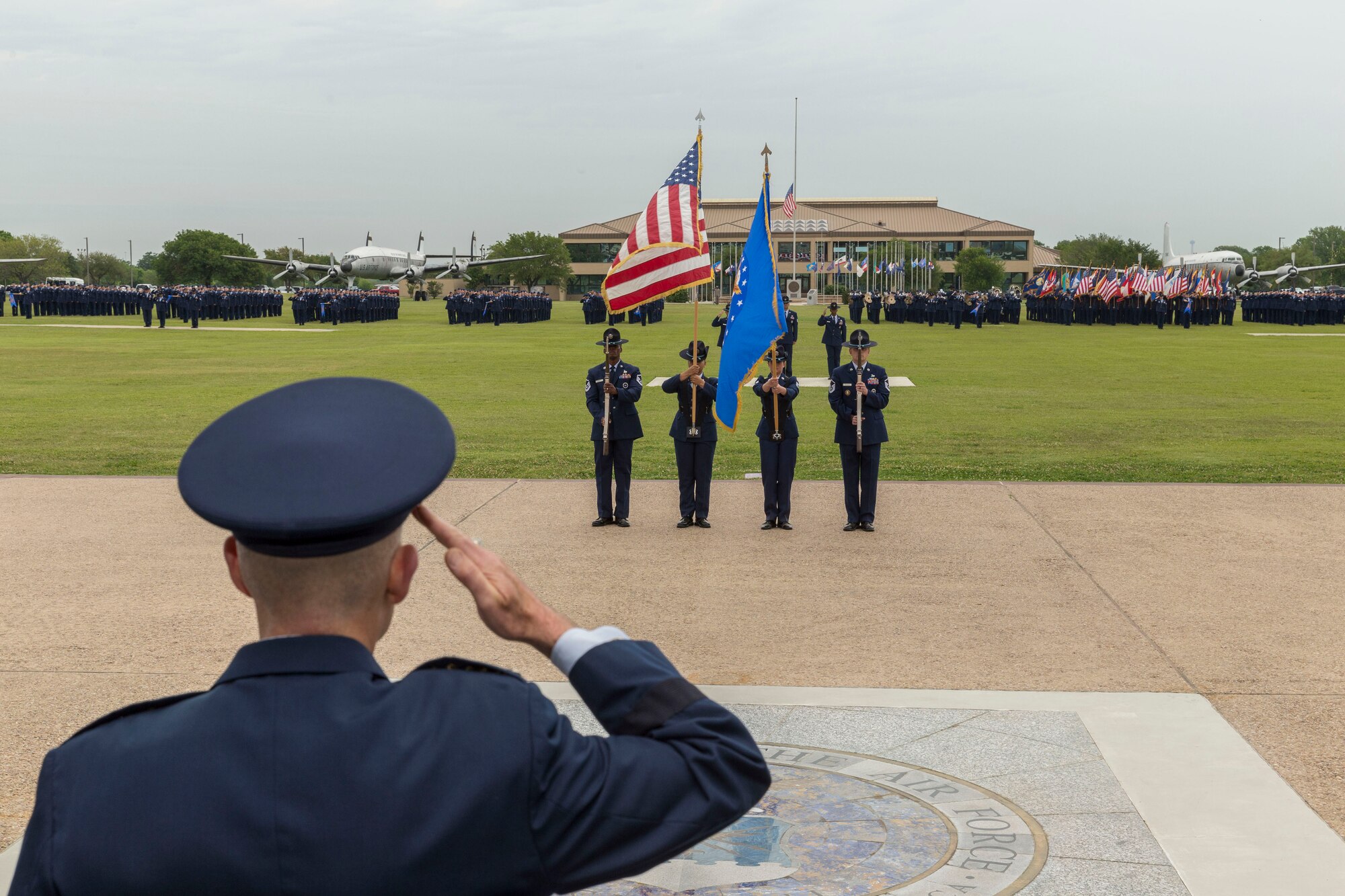 Lt. Gen. Steven L. Kwast (Left), Commander of the Air Education and Training Command salutes at Joint Base San Antonio-Lackland, Texas during a basic military training graduation ceremony April 20, 2018. The ceremony also acknowledged the beginning of “Fiesta San Antonio,” the city’s annual festival held to honor the memory of the battles of the Alamo and San Jacinto. (U.S. Air Force photo by Ismael Ortega / Released)