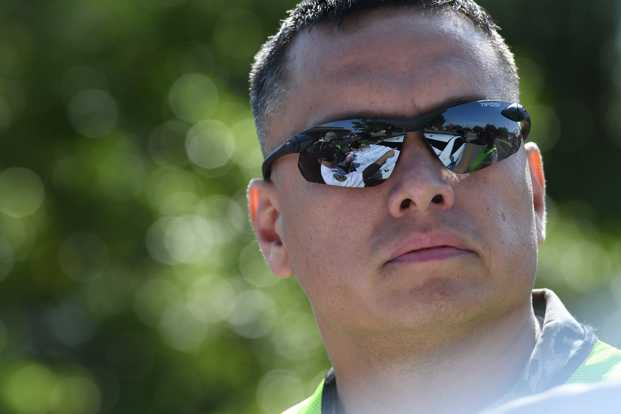 U.S. Air Force Master Sgt. Jeremy Noah, 81st Infrastructure Division assistant fire chief of training, stands by as the Keesler fire chief discusses the action plan during an active shooter exercise near the Levitow Training Support Facility at Keesler Air Force Base, Mississippi, April 19, 2018. An active duty Air Force member simulated opening fire at the facility in order to test the base’s ability to respond and recover from a mass casualty event. (U.S. Air Force photo by Kemberly Groue)