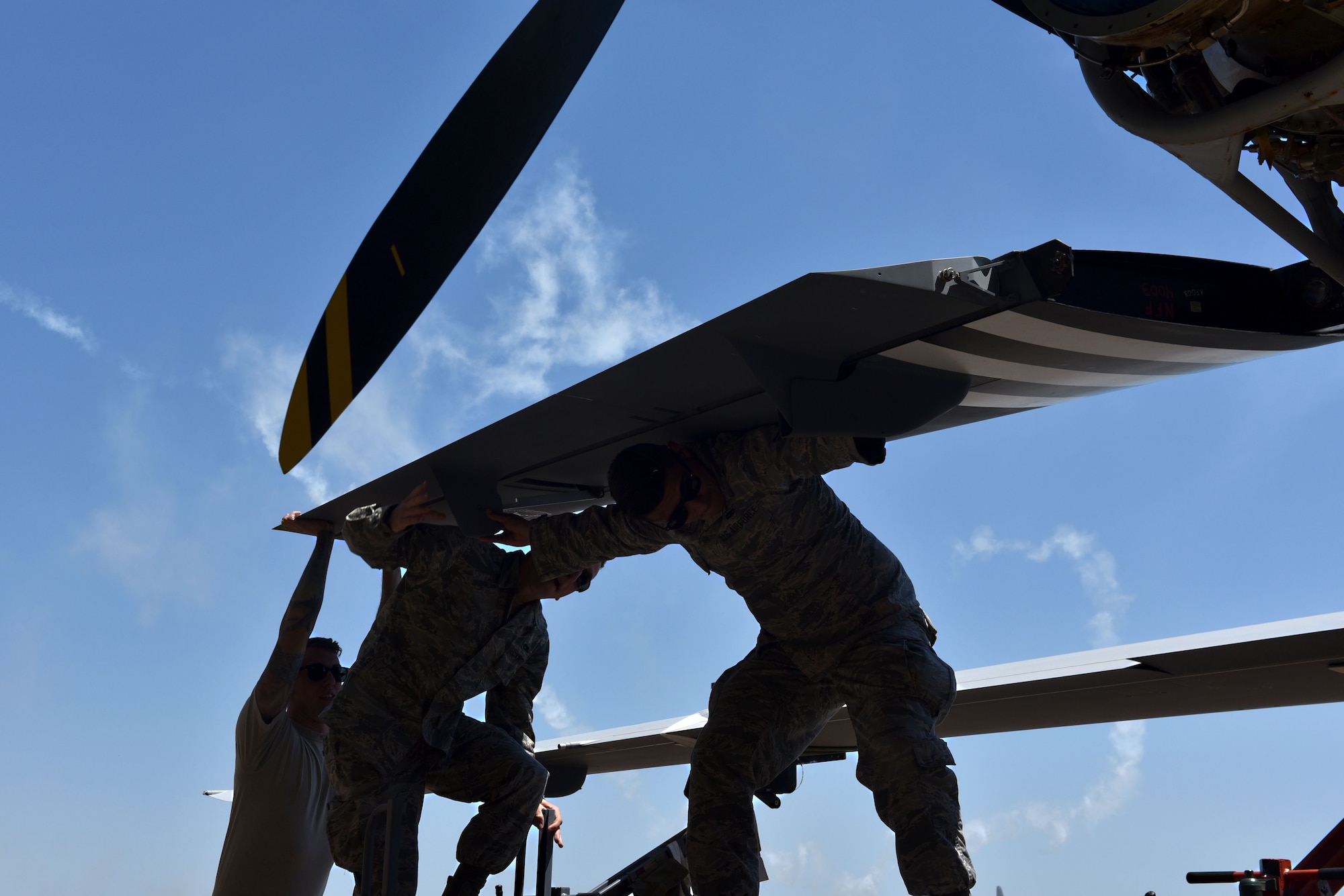 Maintenance Airmen assigned to the 432nd Aircraft Squadron prepare the Air Force’s only MQ-9 Reaper model static display for the 2018 Air and Space Expo season April 20, 2018 at Columbus Air Force, Mississippi. Aircrew, crew chiefs, intelligence and public affairs Airmen informed community leaders and military supporters of the contributions of Remotely Piloted Aircraft at the Wings Over Columbus Air and Space Expo April 21, kicking off the 2018 season. (U.S. Air Force photo by 1st Lt. Annabel Monroe)