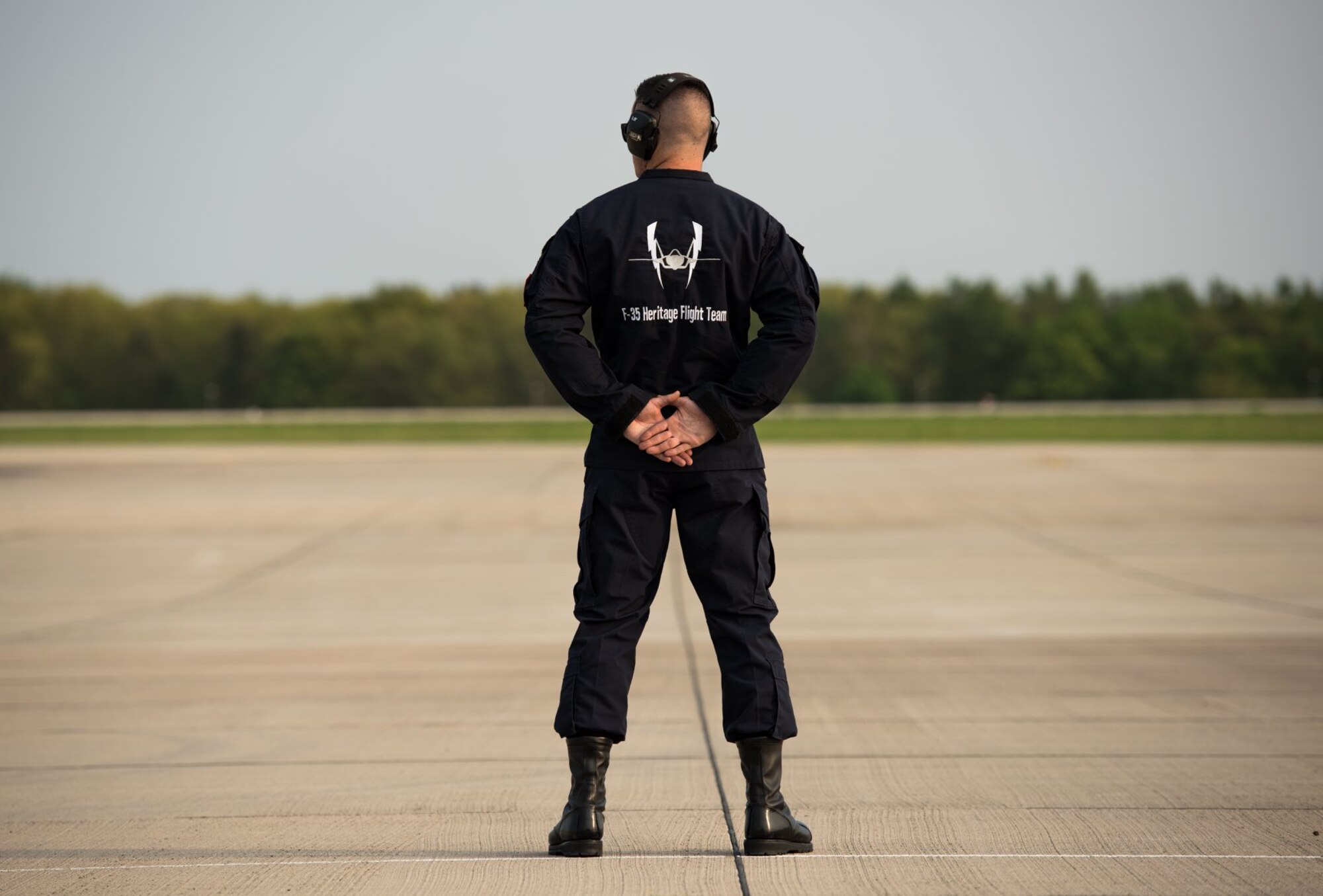 Staff Sgt. Zachary Madera, F-35 Heritage Flight Team crew chief, stands at parade rest at the Berlin Schönefeld Airport, in Berlin, Germany, April 22, 2018. The Berlin Air and Trade show provides a collaborative opportunity to share and strengthen the U.S. and European strategic partnership that has been forged during the last seven decades and is built on a foundation of shared values, experiences, and vision. (U.S. Air Force photo by Airman 1st Class Alexander Cook)