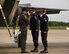 Capt. Andrew “Dojo” Olson, F-35 Heritage Flight Team commander and pilot, salutes  both Staff Sgt. Patrick Murphy and Staff Sgt. John Baker, F-35 Heritage Flight Team crew chiefs, upon arrival for the 2018 Berlin Air and Trade Show at the Berlin Schönefeld Airport, in Berlin, Germany, April 22, 2018. The Berlin Air and Trade Show provides an invaluable forum to demonstrate the types of weapons and technology that promote the goals of enhancing the security of our allies and improving interoperability. (U.S. Air Force photo by Airman 1st Class Alexander Cook)