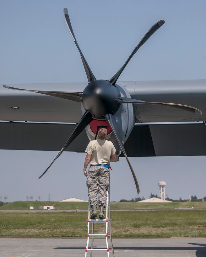 Staff Sgt. Mark Lucas, 374th Aircraft Maintenance Squadron, conducts a post flight inspection on a C-130J Super Hercules aircraft at Yokota Air Base, Japan