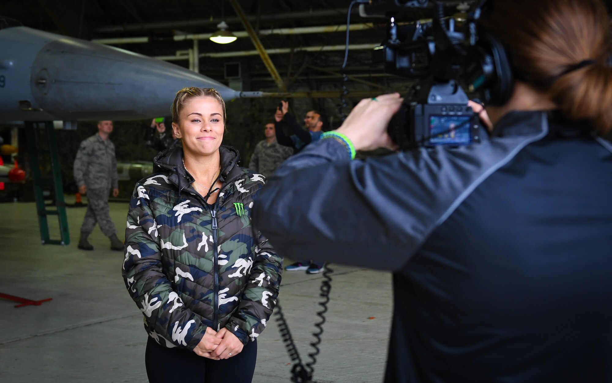 Ultimate Fighting Championship fighter Paige VanZant answers questions from a USO videographer during a tour at Osan Air Base, April 23, 2018.