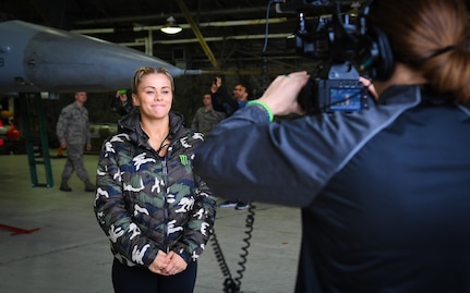 Ultimate Fighting Championship fighter Paige VanZant answers questions from a USO videographer during a tour at Osan Air Base, April 23, 2018.