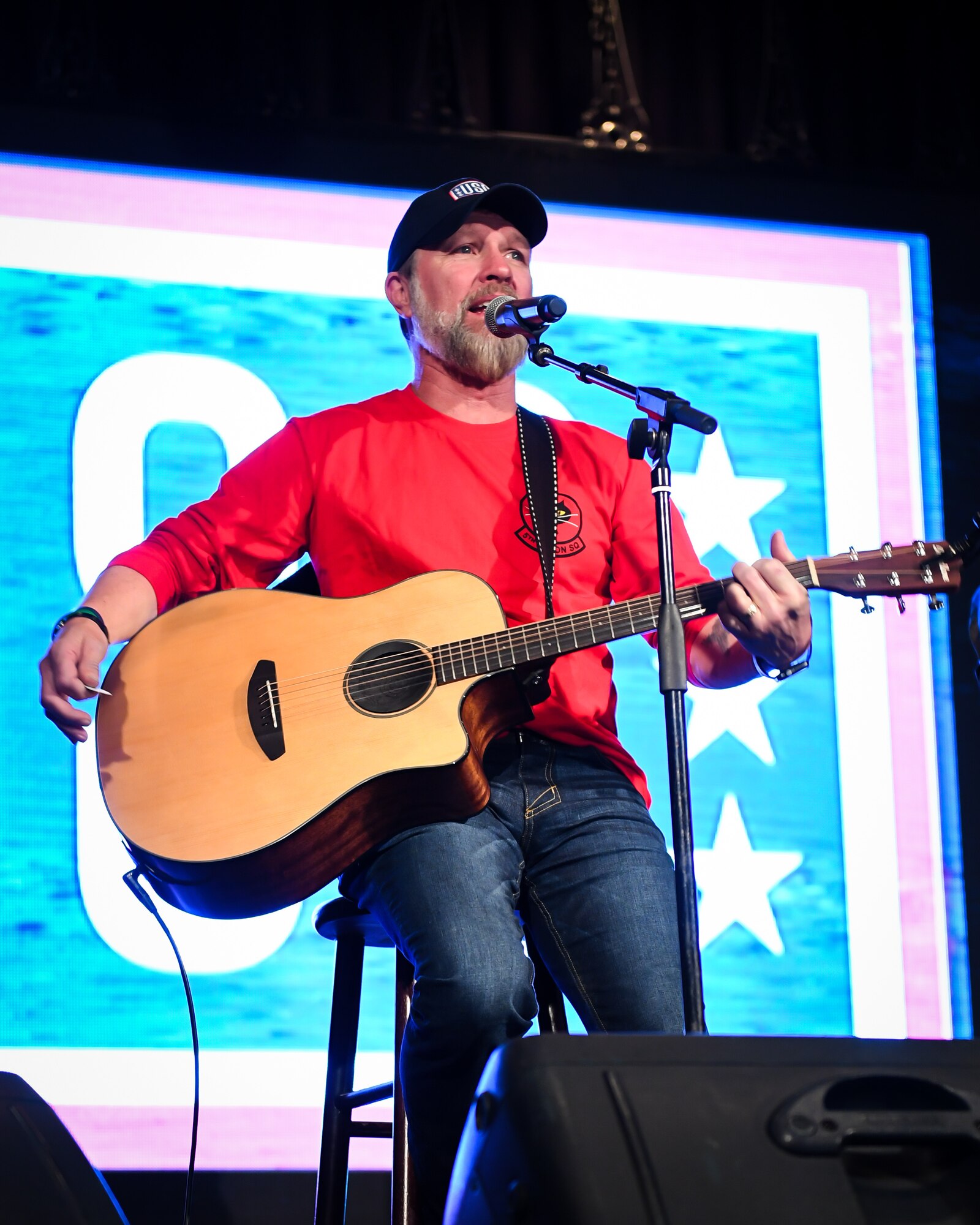 Award-winning country music singer and U.S. Army veteran Craig Morgan performs before a crowd during a USO tour at Osan Air Base, Republic of Korea, April 23, 2018.