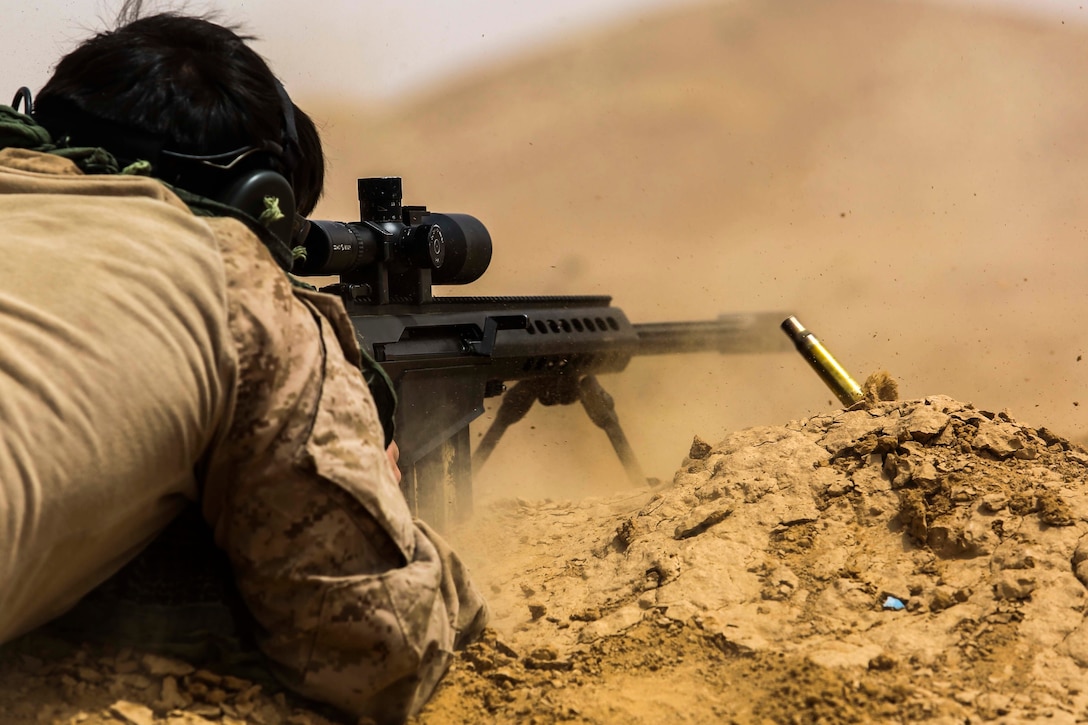 A U.S. Marine assigned to Scout Sniper Platoon, Weapons Company, Battalion Landing Team, 2nd Battalion, 6th Marine Regiment, 26th Marine Expeditionary Unit, fires an M107 Special Applications Scoped Rifle at a target during Eager Lion in Jordan, April 21, 2018. Eager Lion is a capstone training engagement that provides U.S. forces and the Jordan Armed Forces an opportunity to rehearse operating in a coalition environment and to pursue new ways to collectively address threats to regional security.