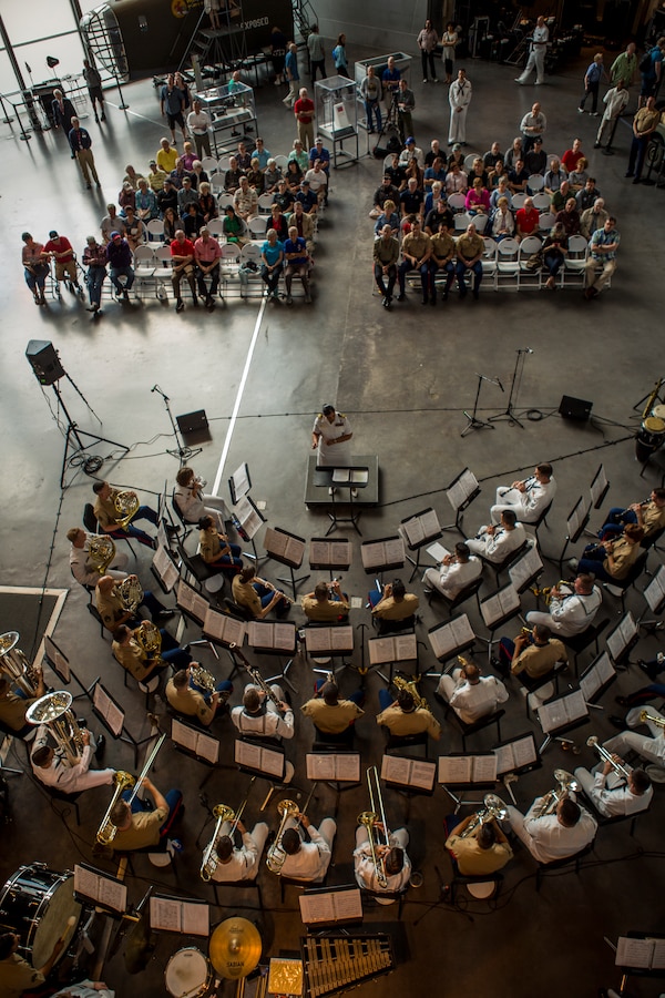 Marines with Marine Corps Band New Orleans accompanied by sailors from Navy Band Southeast out of Jacksonville, Florida, perform at the World War II Museum for Navy week in New Orleans, April 21, 2018. The celebration is an opportunity for citizens of New Orleans and surrounding areas to meet service members and witness the latest capabilities of today’s maritime service. (U.S. Marine Corps photo by Lance Cpl. Melany Vasquez/Released)