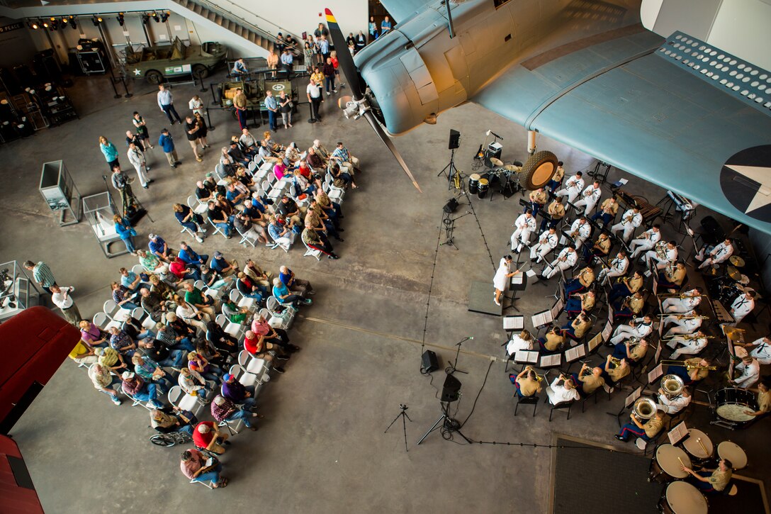 Marines with Marine Corps Band New Orleans accompanied by sailors from Navy Band Southeast out of Jacksonville, Florida, perform at the World War II Museum for Navy week in New Orleans, April 21, 2018. The celebration is an opportunity for citizens of New Orleans and surrounding areas to meet service members and witness the latest capabilities of today’s maritime service. (U.S. Marine Corps photo by Lance Cpl. Melany Vasquez/Released)