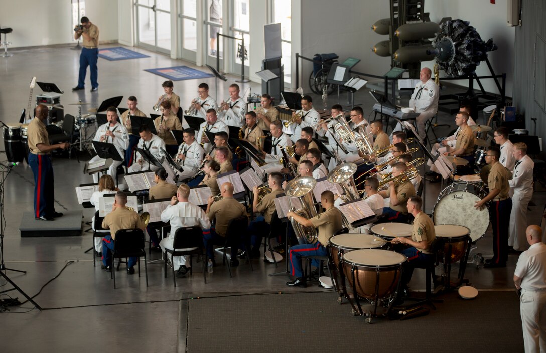 Chief Warrant Officer 2 DeMarius Jackson (left), officer in charge of Marine Corps Band New Orleans, conducts the Marines with Marine Corps Band New Orleans and the sailors from Navy Band Southeast out of Jacksonville, Florida, perform at the World War II Museum for Navy week in New Orleans, April 21, 2018. The celebration is an opportunity for citizens of New Orleans and surrounding areas to meet service members and witness the latest capabilities of today’s maritime service. (U.S. Marine Corps photo by Lance Cpl. Melany Vasquez/Released)