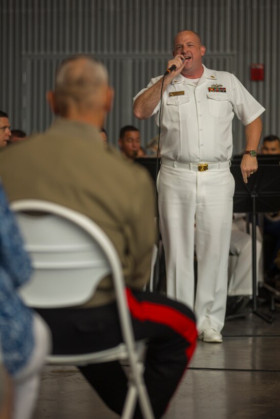 Thomas Horner, a performer with of Navy Band Southeast, sings with the accompany of the Marine Corps Band New Orleans and Navy Band Southeast out of Jacksonville, Florida, at the World War II Museum for Navy week in New Orleans, April 21, 2018.