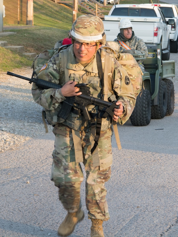 Assigned to the Fort Hood Regional Training Site-Maintenance, 3rd Brigade, 94th Training Division, Sgt. 1st Class Fabian Balarezo pushes himself to the 7.5-mile ruck march finish line as part of the 80th Training Command's 2018 Best Warrior Competition at Fort Knox, Kentucky, April 12, 2018. (U.S. Army Reserve photo by Maj. Addie Leonhardt, 80th Training Command)