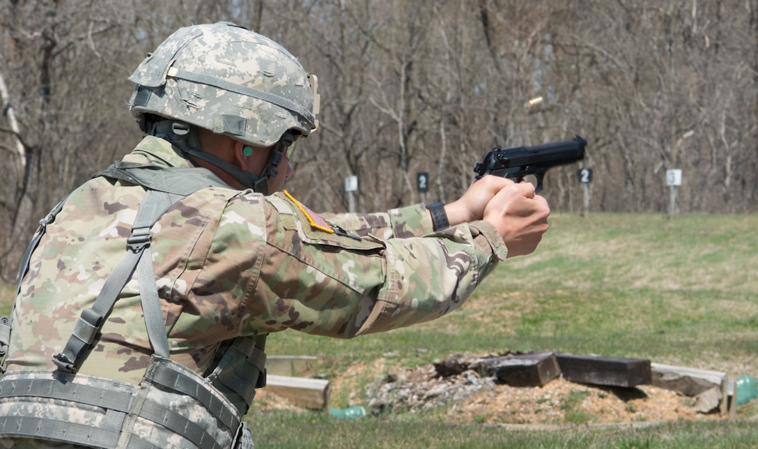 An Army Reserve Soldier fires a 9mm pistol at the weapons qualification range as part of the 80th Training Command's 2018 Best Warrior Competition at Fort Knox, Kentucky, April 12, 2018. (U.S. Army Reserve photo by Maj. Addie Leonhardt, 80th Training Command)