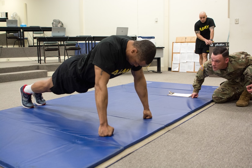 Staff Sgt. DeMarko Snow, assigned to Fort Dix Noncommissioned Officer Academy, 83rd U.S. Army Reserve Readiness Training Center, 100th Training Division, goes hard core on push-ups for the physical fitness test as part of the 80th Training Command's 2018 Best Warrior Competition at Fort Knox, Kentucky, April 13, 2018. (U.S. Army Reserve photo by Maj. Addie Leonhardt, 80th Training Command)