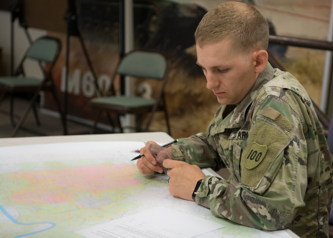 Staff Sgt. Ethan Kruger, with the Camp Parks Noncommissioned Officer Academy,  83rd U.S. Army Reserve Readiness Training Center, 100th Training Division, puts his map-reading skills to the test at the 80th Training Command's 2018 Best Warrior Competition at Fort Knox, Kentucky, April 13, 2018. (U.S. Army Reserve photo by Maj. Addie Leonhardt, 80th Training Command)