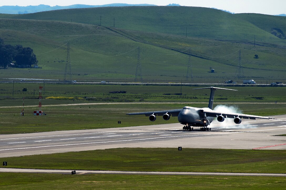 A C-5M Super Galaxy taxi on the flight line.