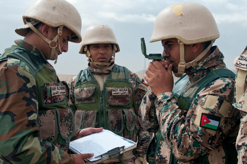 Jordanian Sgt. Mezan Ali, a member of a fires support team, measures the direction of a target for an indirect fire mission during an exercise at Jordan’s Joint Training Center near Amman, Jordan, April 11, 2018.  The bilateral training with U.S. forces was part of the Jordan Operational Engagement Program and focused on the exchange of infantry tactics and techniques.